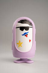 Jules in the purple outfit with a face drawn on in dry-erase pen