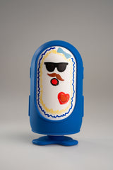 Jules in the blue outfit with a face drawn on in dry-erase pen